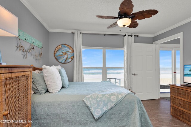 bedroom featuring ornamental molding, ceiling fan, access to exterior, and multiple windows