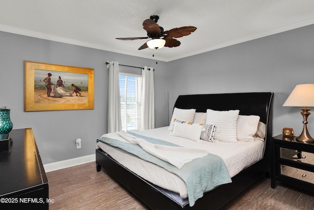 bedroom with ceiling fan, crown molding, dark hardwood / wood-style floors, and a textured ceiling