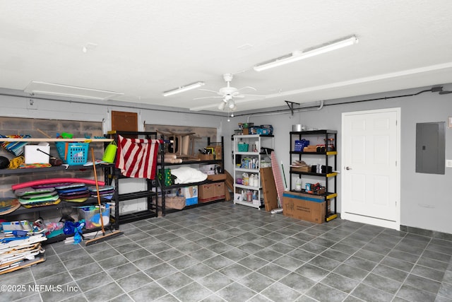 garage with electric panel and ceiling fan