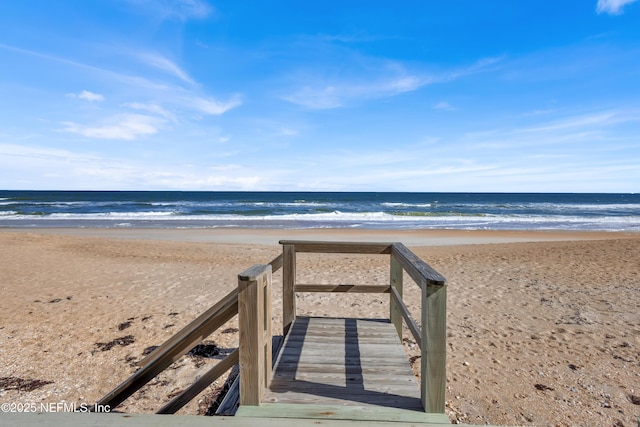 view of home's community featuring a view of the beach and a water view