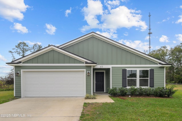 view of front of property with a garage and a front lawn