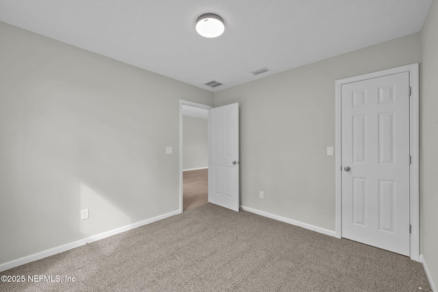 unfurnished bedroom featuring carpet flooring