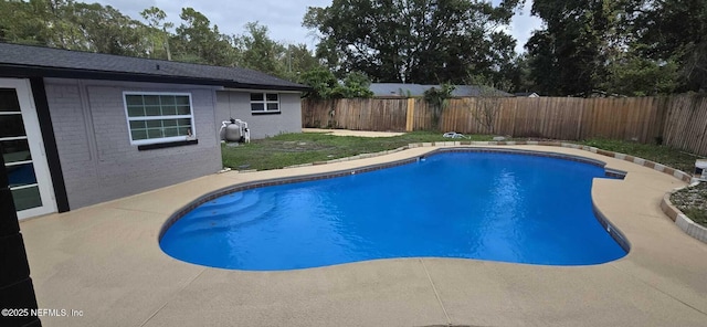 view of pool featuring a fenced in pool, a patio area, and a fenced backyard