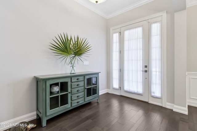 doorway to outside featuring crown molding and dark hardwood / wood-style flooring