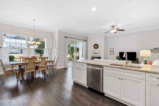 kitchen featuring white cabinetry, light stone countertops, dishwasher, and hanging light fixtures