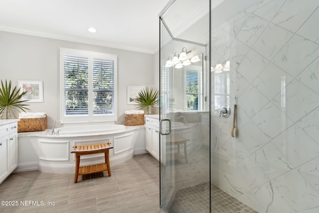 bathroom with vanity, crown molding, and separate shower and tub