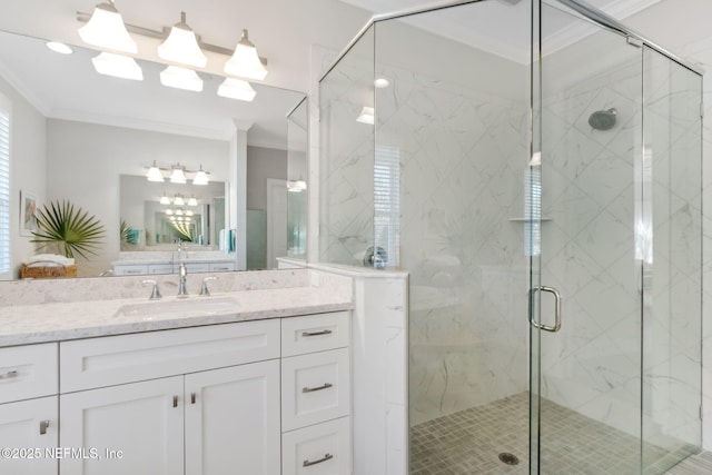 bathroom featuring crown molding, vanity, and a shower with shower door