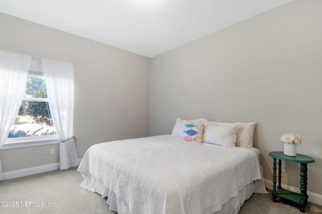 bedroom featuring light carpet