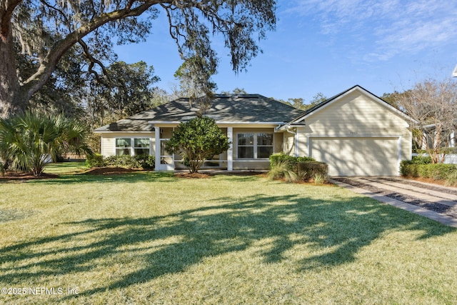 ranch-style home featuring a garage and a front yard