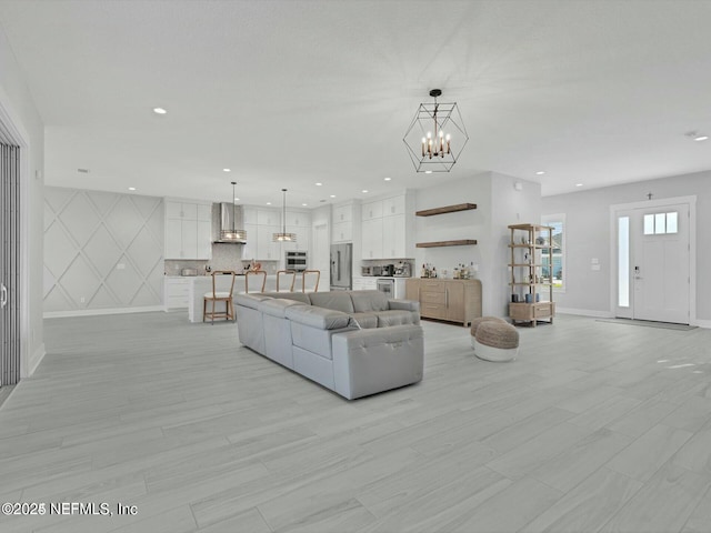 living room with a notable chandelier