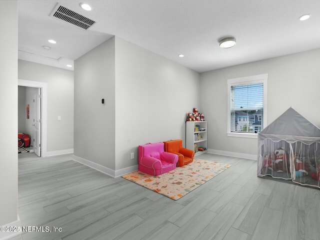 game room featuring light hardwood / wood-style flooring