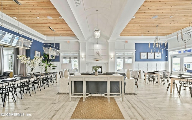 dining area featuring plenty of natural light, wood ceiling, a notable chandelier, and ornamental molding