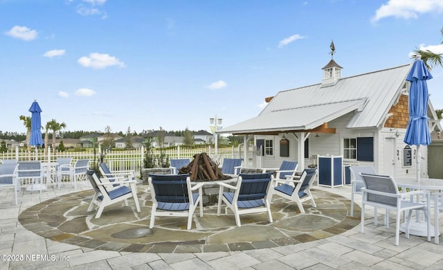 view of patio with an outdoor fire pit