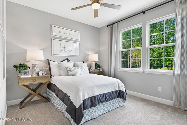 carpeted bedroom featuring ceiling fan