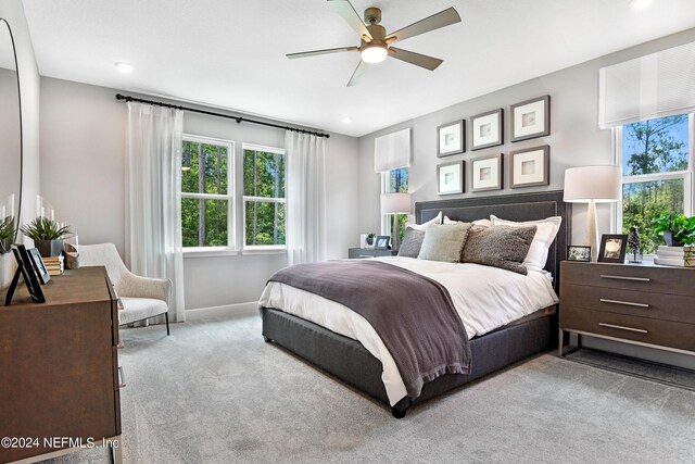 carpeted bedroom featuring ceiling fan