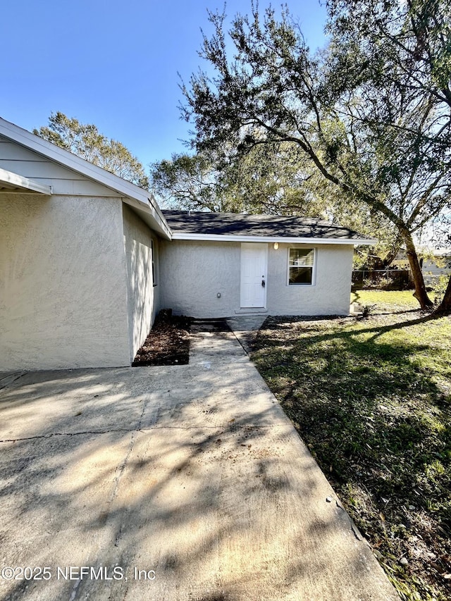 back of house with a yard