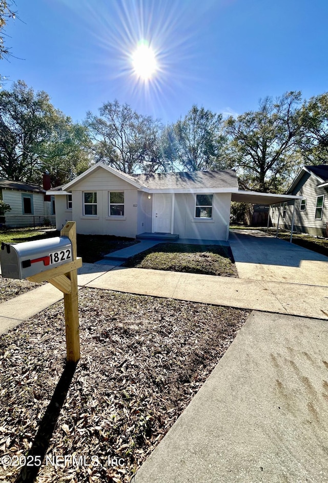 single story home with a carport