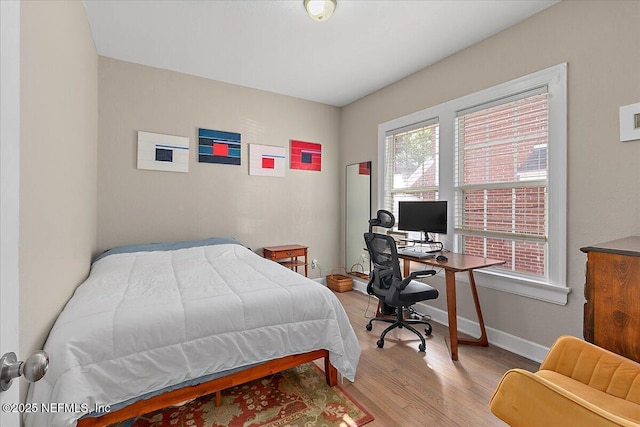 bedroom with light hardwood / wood-style floors