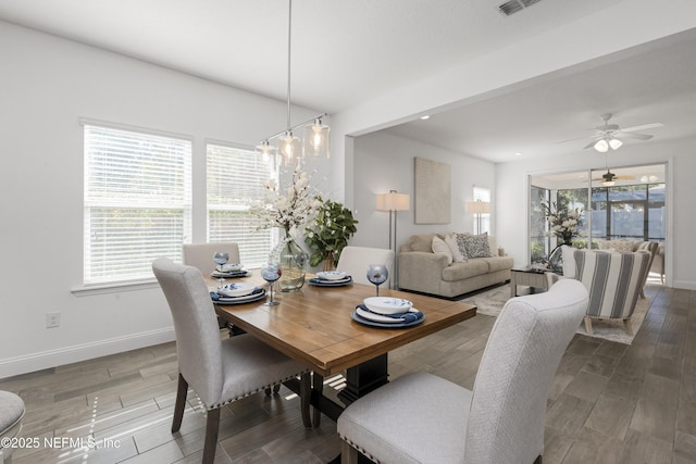 dining space with ceiling fan