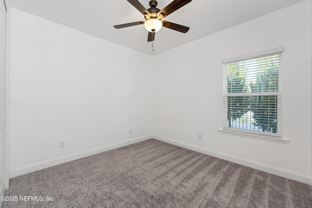 carpeted empty room featuring ceiling fan