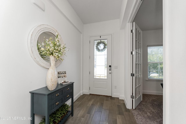 entrance foyer with dark wood-type flooring and french doors