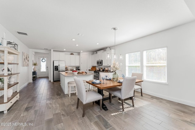 dining room with light hardwood / wood-style flooring