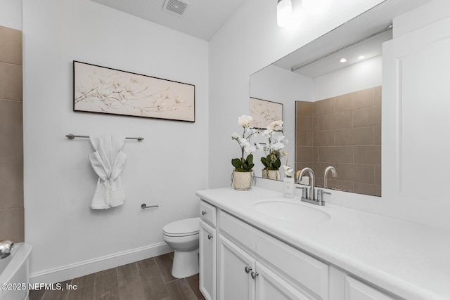 bathroom with vanity and toilet