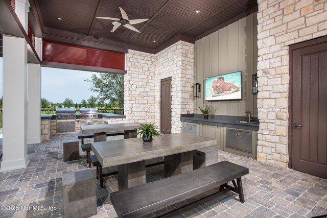 323 Belfort Ct, Saint Augustine, FL 32092 - view of patio with exterior kitchen, a grill, sink, and ceiling fan