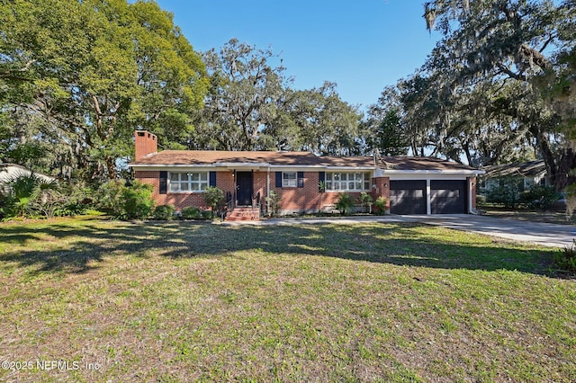 ranch-style home with a front yard and a garage