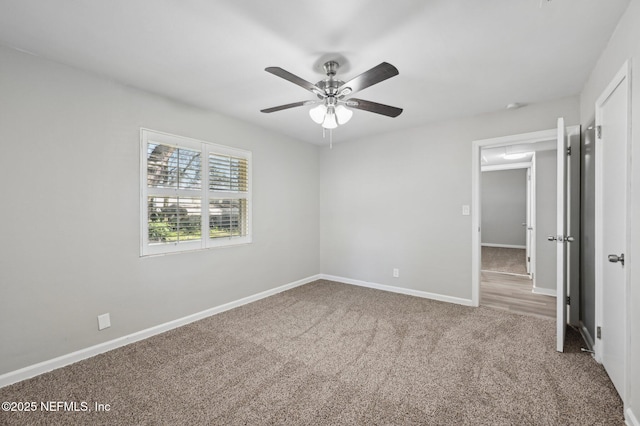 unfurnished bedroom featuring ceiling fan and carpet