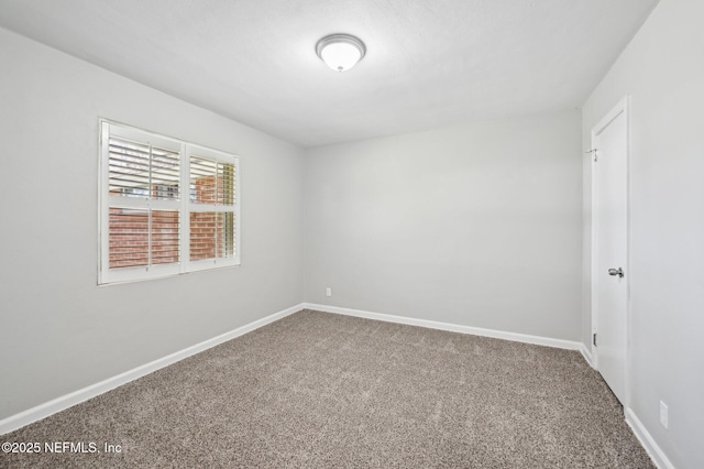 empty room featuring carpet floors