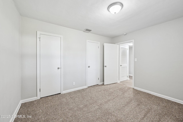 unfurnished bedroom featuring carpet flooring