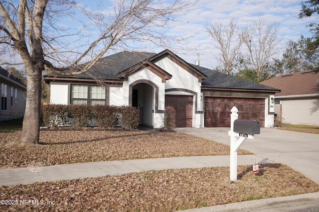 ranch-style home featuring a garage