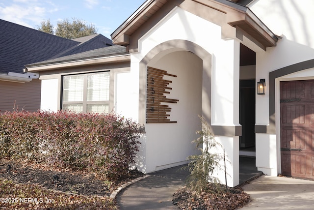 view of exterior entry featuring a garage