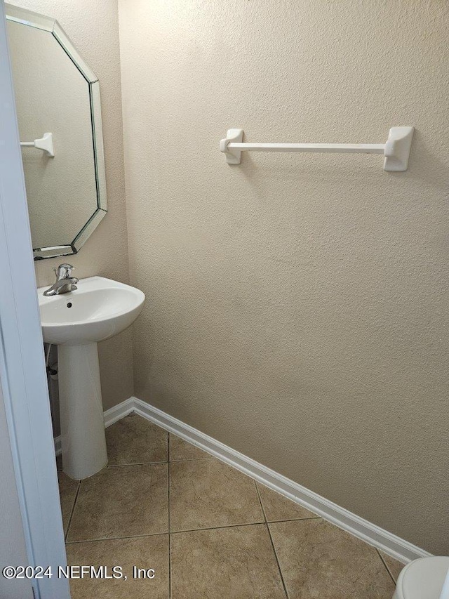 bathroom featuring tile patterned floors and sink