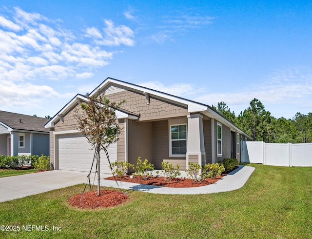 view of front of house with a front lawn and a garage