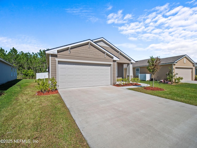 view of front of property featuring cooling unit, a front lawn, and a garage