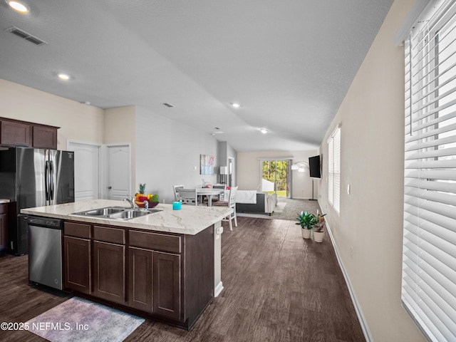 kitchen featuring dishwasher, sink, dark hardwood / wood-style floors, an island with sink, and dark brown cabinets