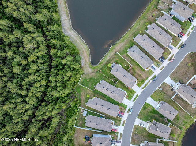 bird's eye view with a water view