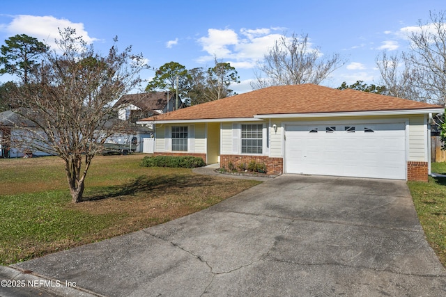 single story home with a front yard and a garage