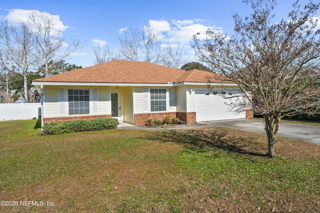 ranch-style house featuring a garage and a front lawn