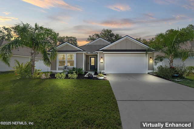 single story home featuring a garage and a lawn