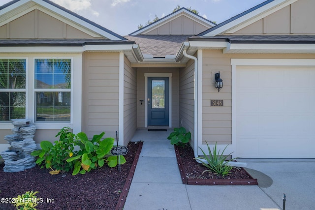 doorway to property featuring a garage