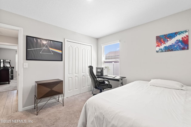 carpeted bedroom with a closet