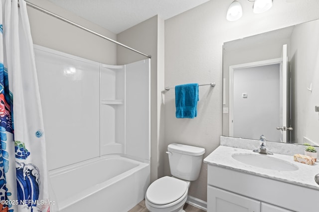 full bathroom featuring vanity, shower / bathtub combination with curtain, a textured ceiling, and toilet