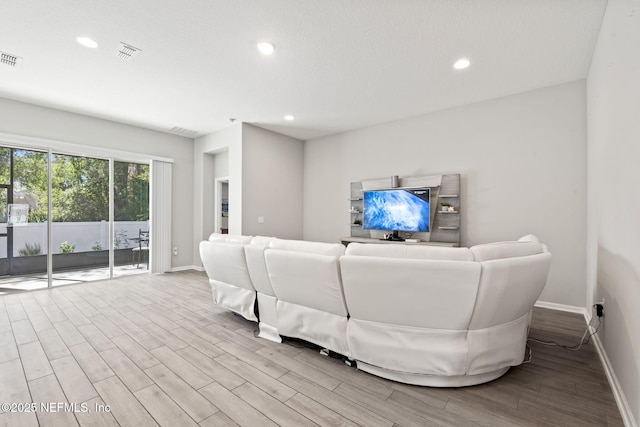 living room with light hardwood / wood-style flooring