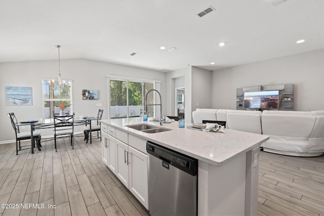 kitchen featuring sink, hanging light fixtures, dishwasher, an island with sink, and white cabinets