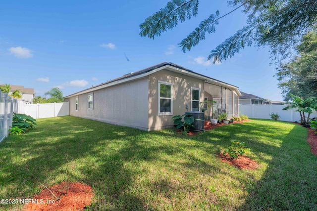 exterior space featuring a yard and central air condition unit