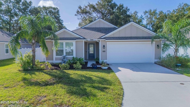 view of front of house with a garage and a front lawn