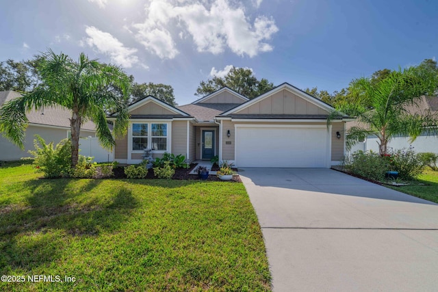 view of front of house with a garage and a front yard